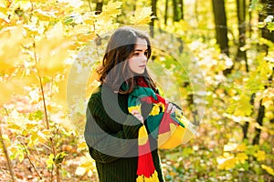 Autumn teenage girl. Portrait of beautiful young teen girl walking outdoors in autumn.