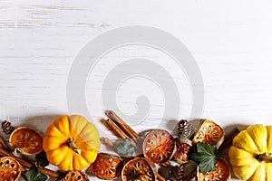 Autumn thanksgiving background with fancy pumpkins and dried fruits