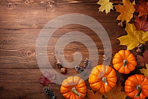 Autumn Thanksgiving background. Pumpkins, acorns and leaves on rustic table top view