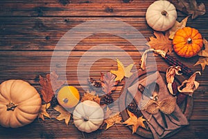 Autumn and Thanksgiving background with pumpkins and autumn leaves