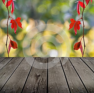 Autumn theme and empty wooden deck table.