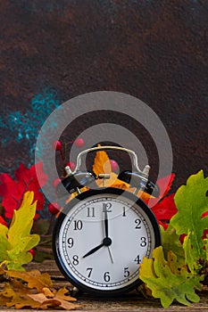 Autumn time - fall leaves with clock