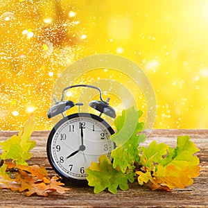 Autumn time - fall leaves with clock