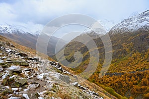 Autumn trail to Lake Donguzorun Kol along the mountainside