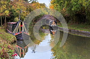 Autumn trees, Boats, bridges and Tunnels reflected in the Grand Union Canal