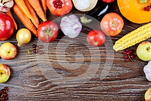 Autumn vegetables harvest, raw healthy organic food on wooden background
