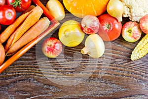 Autumn vegetables Thanksgiving harvest, raw healthy organic food on wooden background