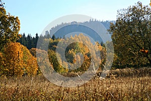 Autumn view on peak Stolowe Mountains from Pasterka village in Poland. Szczeliniec