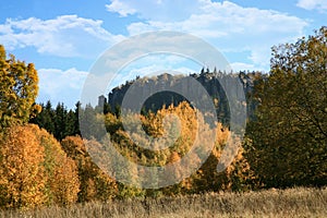 Autumn view on peak Stolowe Mountains from Pasterka village in Poland. Szczeliniec