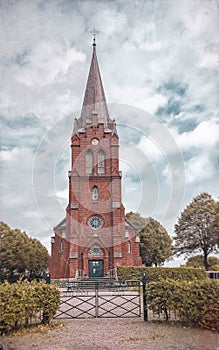 Autumn view of Scandinavian church on a cloudy day located in Sweden.