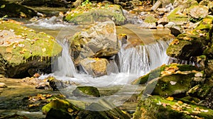 Autumn View of a Small Cascading Waterfall