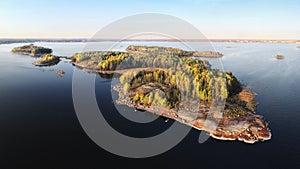 Autumn in Vyborg bay, aero view of clean nordic nature. Beautiful rocks and cliffs with woods in North Europe, Baltic sea, gulf of