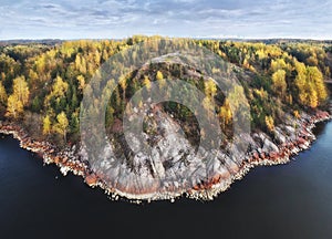 Autumn in Vyborg bay, aero view of clean nordic nature. Beautiful rocks and cliffs with woods in North Europe, Baltic sea, gulf of