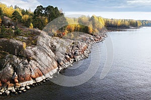 Autumn in Vyborg bay, aero view of clean nordic nature. Beautiful rocks and cliffs with woods in North Europe, Baltic sea, gulf of