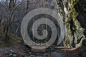 Autumn walk through the maze of Teteven Balkan with high peaks, river, bridge and mossy steep cliff