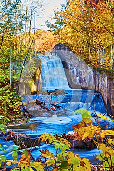 Autumn Waterfall in Michigan with Vibrant Foliage and Motion Blur Effect