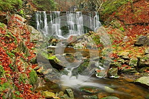 Autumn waterfall on mountain stream in Janske Lazne in Czech republic