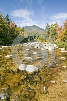 An autumn waterway along the Kancamagus Highway in the White Mountain National Forest, New Hampshire