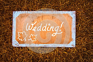 Autumn wedding wooden sign on the grass