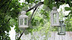 Autumn Whispers: Antique lanterns sway gently in the wind, on a cozy home patio. The sound of raindrops enhances the