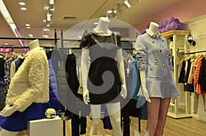 Autumn winter fashion Mannequins in fashion clothing shop photo