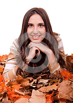 Autumn woman covered with mapple leaves