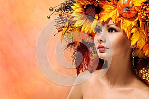 Autumn Woman with Fall Leaves. Portrait of Fashion Girl