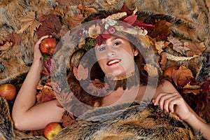 Autumn woman on fur