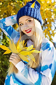 Autumn woman happy with colorful fall leaves