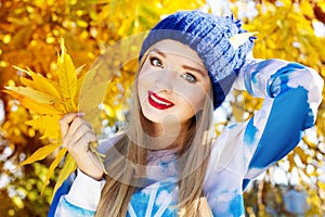 Autumn woman happy with colorful fall leaves