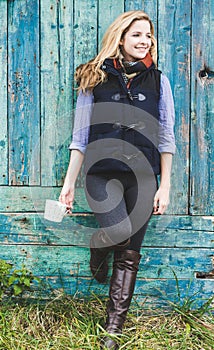 Autumn woman holding coffee mug.