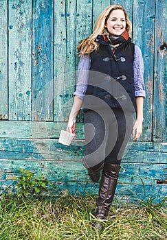 Autumn woman holding coffee mug.