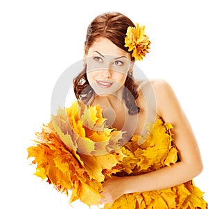 Autumn woman in yellow dress of maple leaves