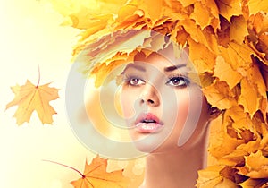 Autumn woman with yellow leaves hairstyle