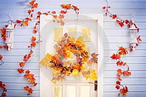Autumn wreath entwined with leaves, garlic, berries, pumpkins, m