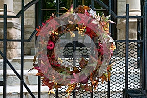 Autumn Wreath on a Gate in front of a Home