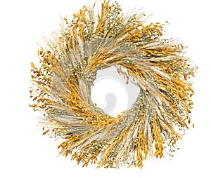 Autumn wreath made of natural dried flowers and various grain ears. Isolate on white.