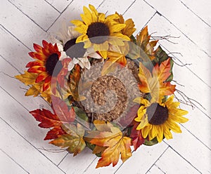 An Autumn Wreath on a White Wooden Wall for Photographers to use as a Newborn Background