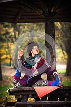 Autumn yoga woman in park