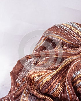 Autumnal browns and golden Shades Textured Fabric Background