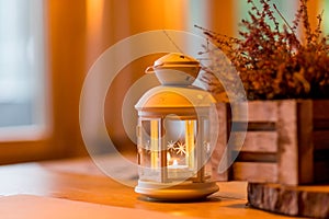 Autumnal decorated terrace.Seasonal home garden autumn decoration with heather flower.White lantern and heath plants in