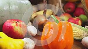 Autumnal harvest or thanksgiving, cornucopia filled with vegetables, vegetables spilled out of the basket on the table