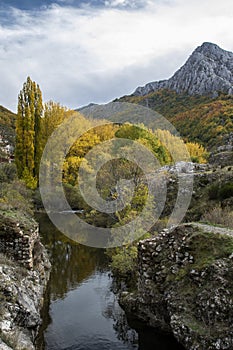 Autumnal landscape on the CurueÃÂ±o river. Cueto Ancino in the background, LeÃÂ³n, Spain photo