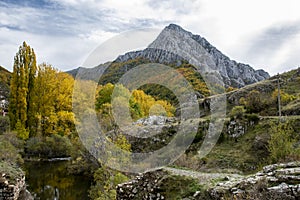 Autumnal landscape on the CurueÃÂ±o river. Cueto Ancino in the background, LeÃÂ³n, Spain photo