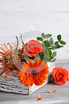 Autumnal orange bouquet with rosa and gerbera
