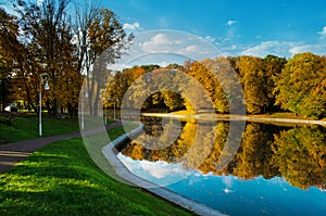 Autumnal park. Lake with reflection. Morning