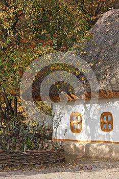 Autumnal scenery. Ukrainian hut.