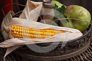 Autumnal stilllife with corn cob and apple