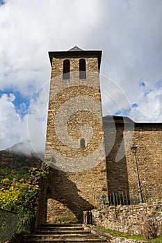 Autumnal view of the tower of the Romanesque church of Torla, in Huesca