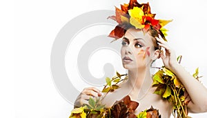 Autumnal woman. Beautiful creative makeup and hair style in fall concept studio shot. Beauty fashion model girl with fall makeup